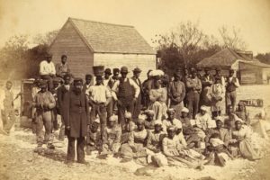Union Army troops and a group of African Americans in Hilton Head during the Civil War.
