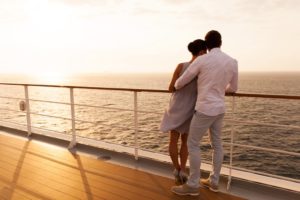 A couple enjoying a sunset cruise.